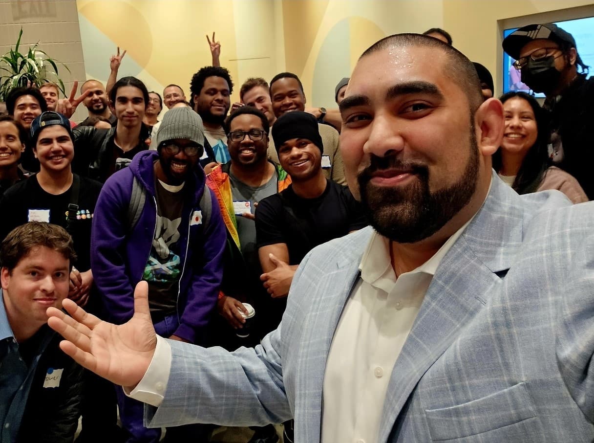 Community members working together on laptops